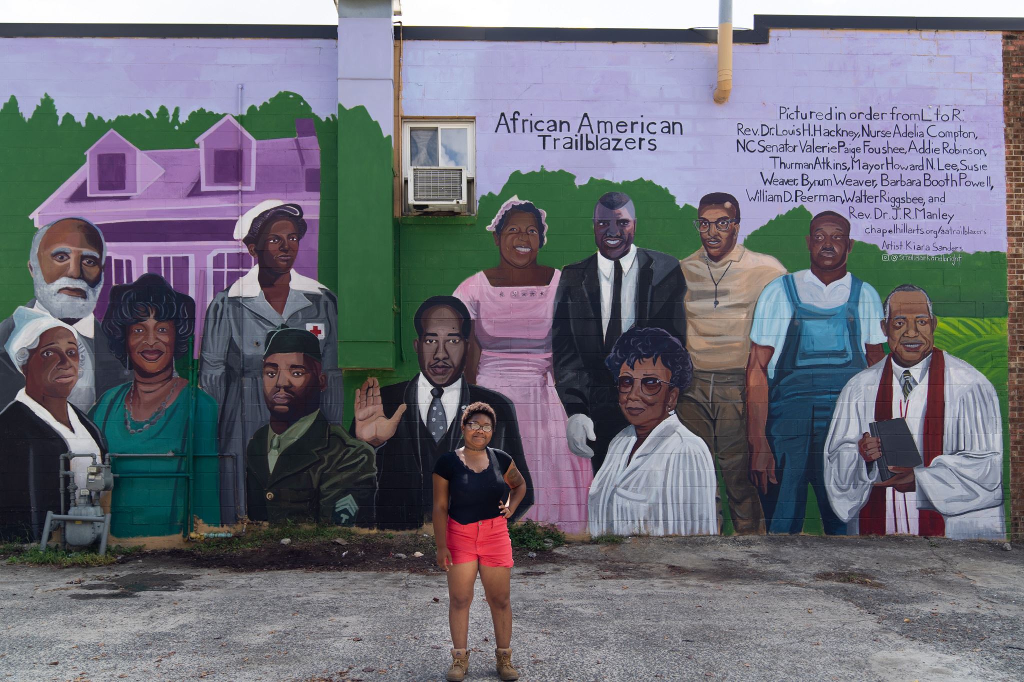 Artist with Trailblazers Mural